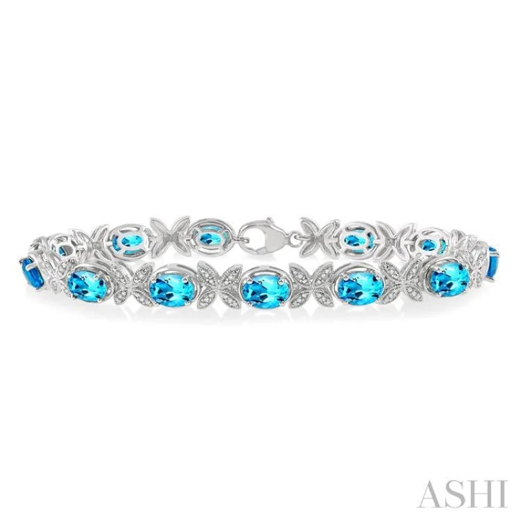 simple chain bracelets for women -1/10 Ctw Round Cut Diamond & 7x5MM Oval Cut Blue Topaz Semi Precious Bracelet in Sterling Silver