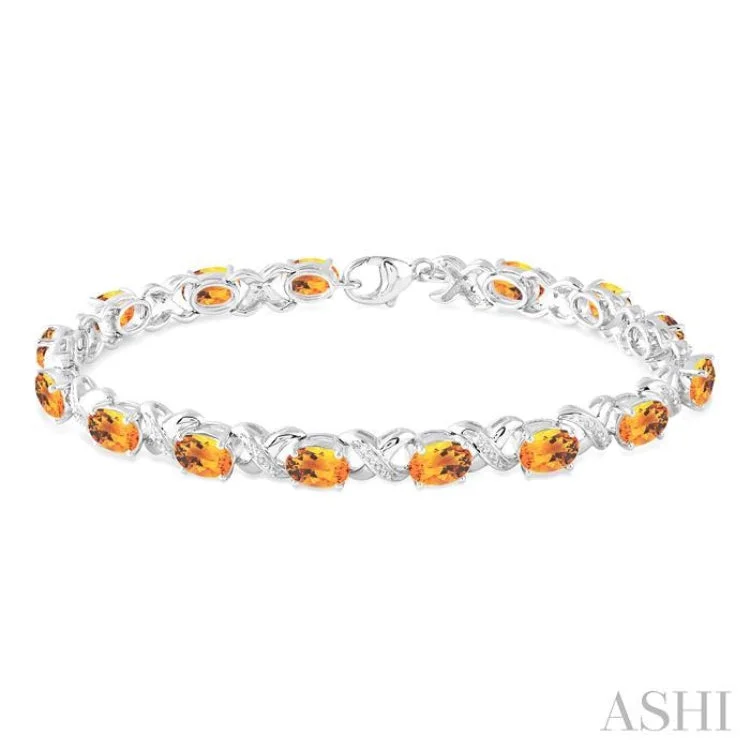 gold-plated bracelets for women -7x5 mm Oval Cut Citrine and 1/20 Ctw Round Cut Diamond Fashion Bracelet in Sterling Silver