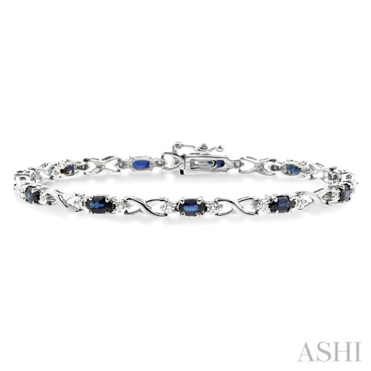 oval bracelets for women -5x3mm Oval Cut Sapphire and 1/10 Ctw Single Cut Diamond Bracelet in 10K White Gold