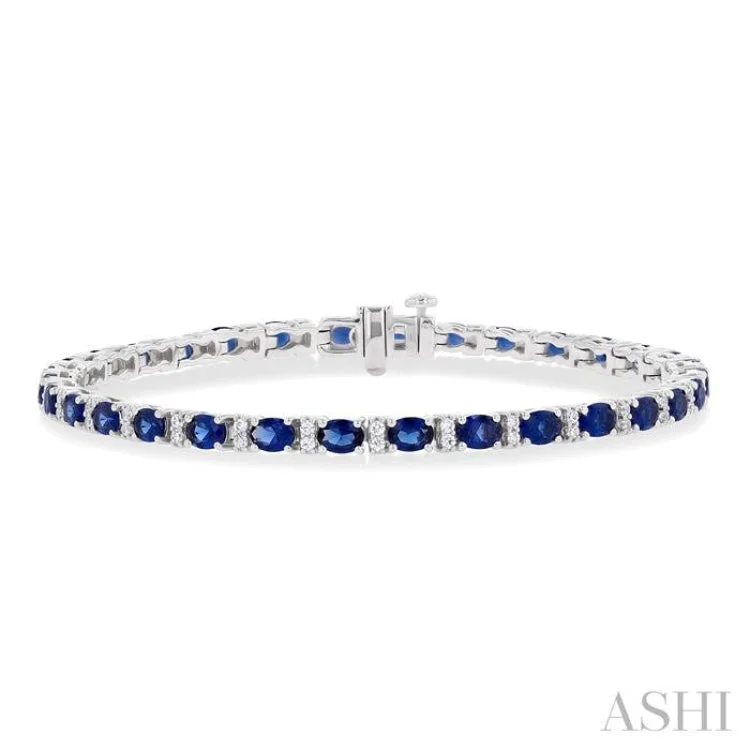 big statement bracelets for women -1/3 ctw Oval Cut 4X3MM Sapphire and Round Cut Diamond Precious Bracelet in 14K White Gold