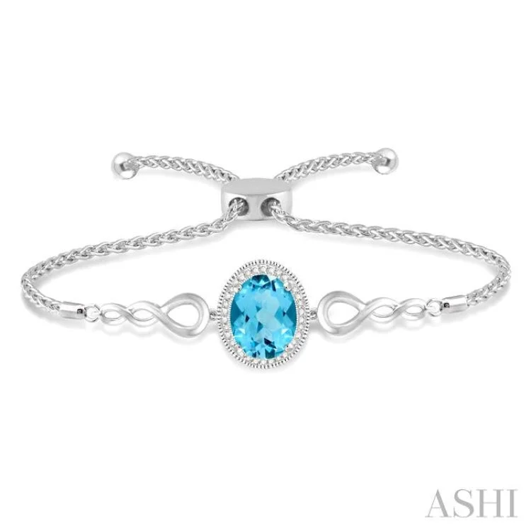 anniversary bracelets for women -1/20 Ctw Oval 10x8mm Blue Topaz Round Diamond Sterling Silver Lariat Bracelet