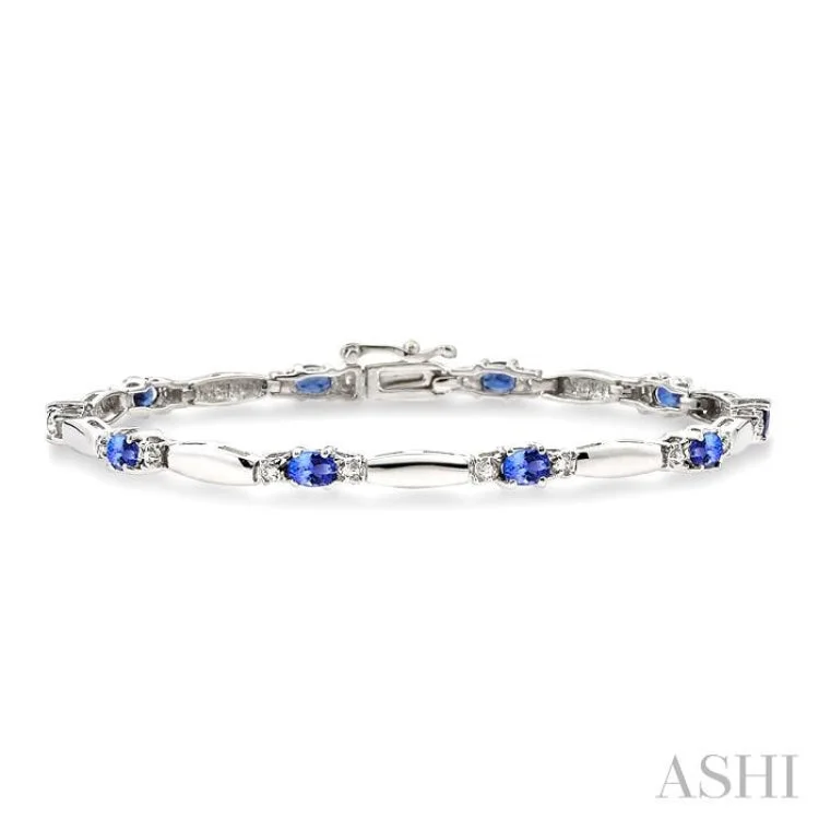 celestial bracelets for women -1/10 Ctw Bar and Oval Mount Round Cut Diamond & 5x3MM Oval Cut Tanzanite Precious Bracelet in 10K White Gold